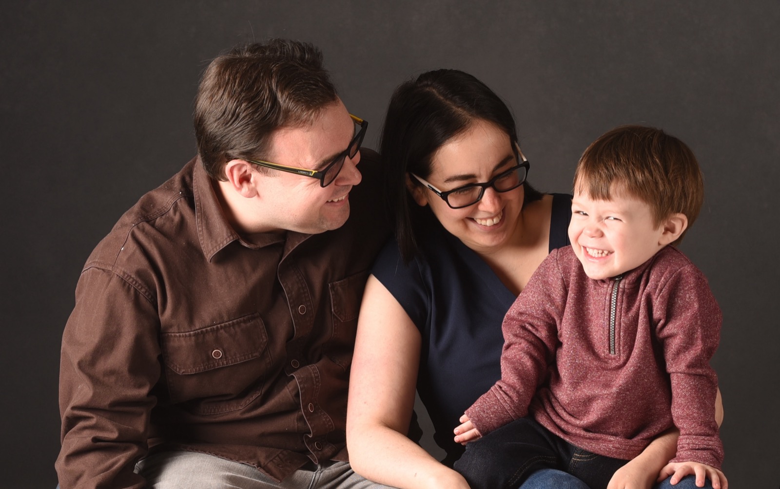 Leah Silber with her husband and young son, laughing together